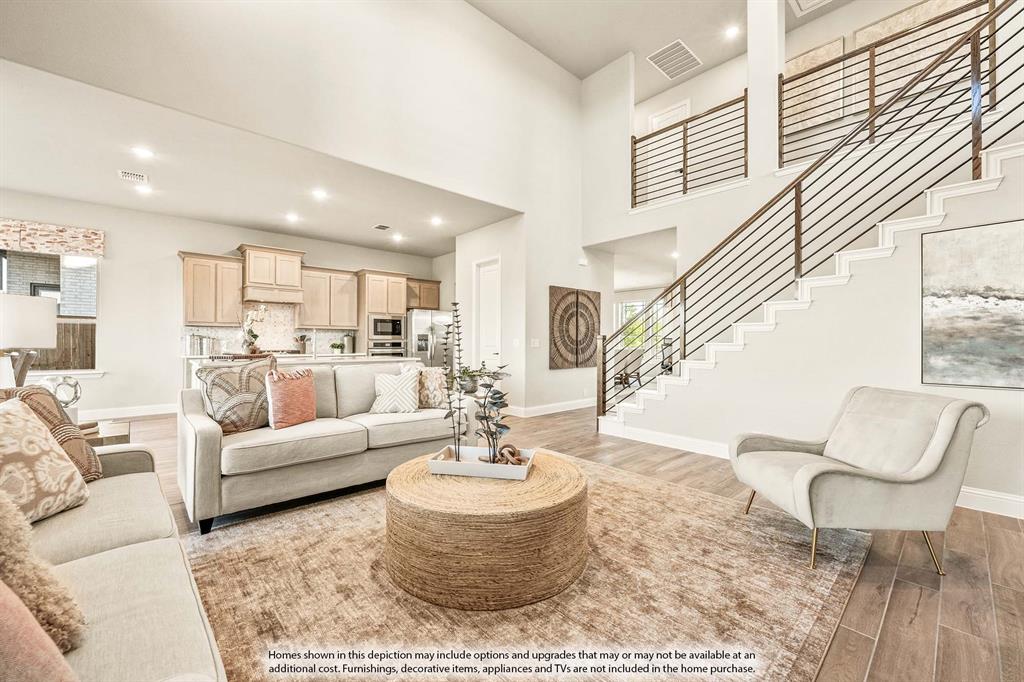 5422 Rutherford Drive Midlothian, TX 76065 - Photo 16 of 36 a living room with furniture and a dining table with kitchen view