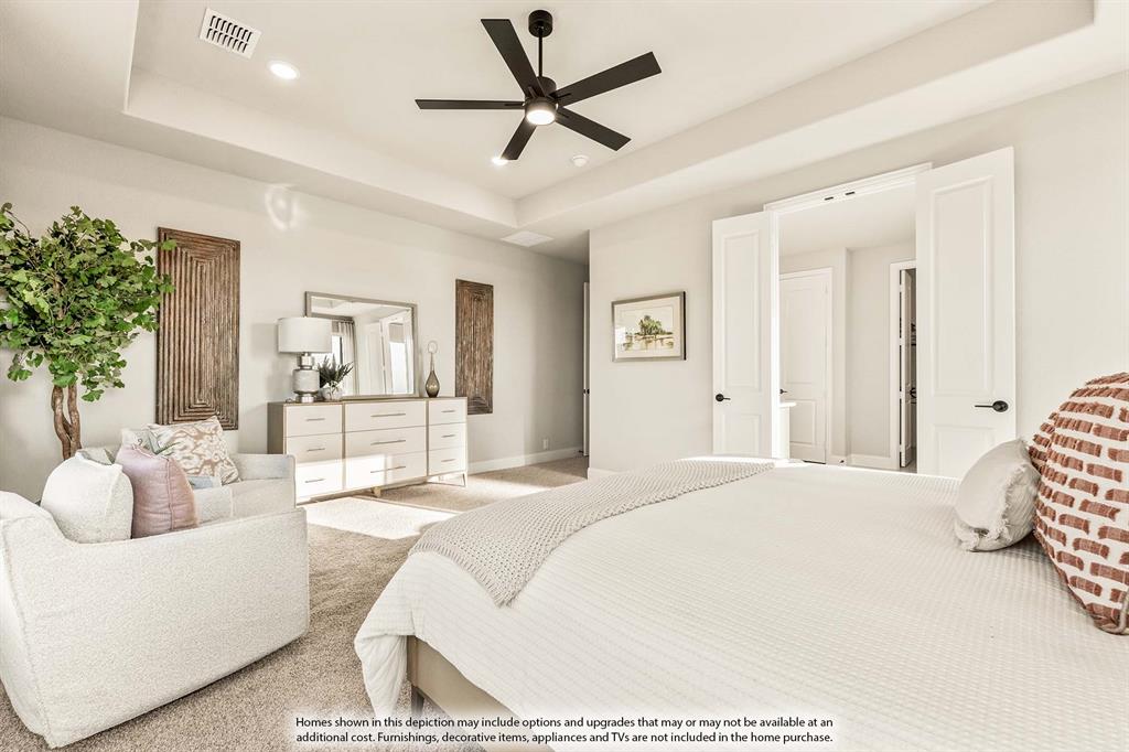 5422 Rutherford Drive Midlothian, TX 76065 - Photo 20 of 36 a spacious bedroom with a bed a couch and a potted plant