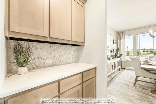 a view of a kitchen from the living room