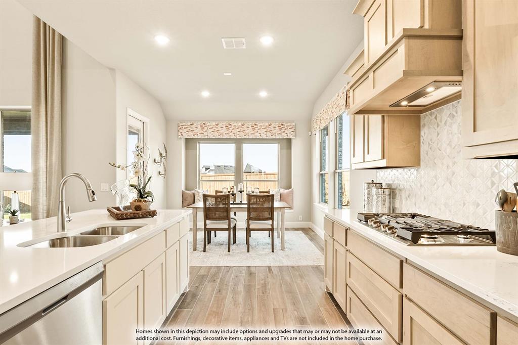 5422 Rutherford Drive Midlothian, TX 76065 - Photo 6 of 36 a kitchen with counter top space a sink cabinets and appliances