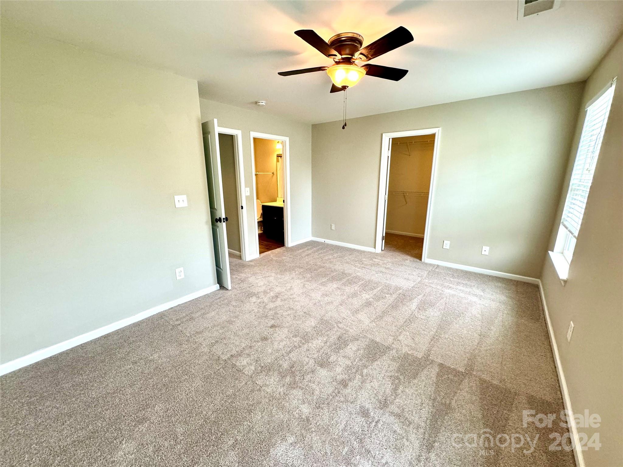 7326 Copper Beech Trace Charlotte, NC 28273 - Photo 18 of 29 a view of an empty room with a window