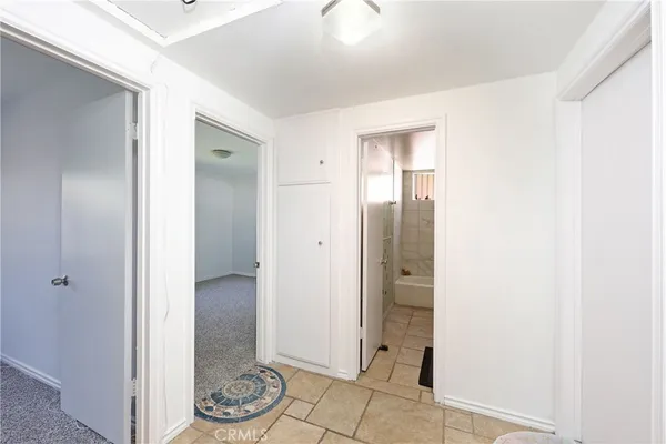 a view of bathroom with a shower and a sink