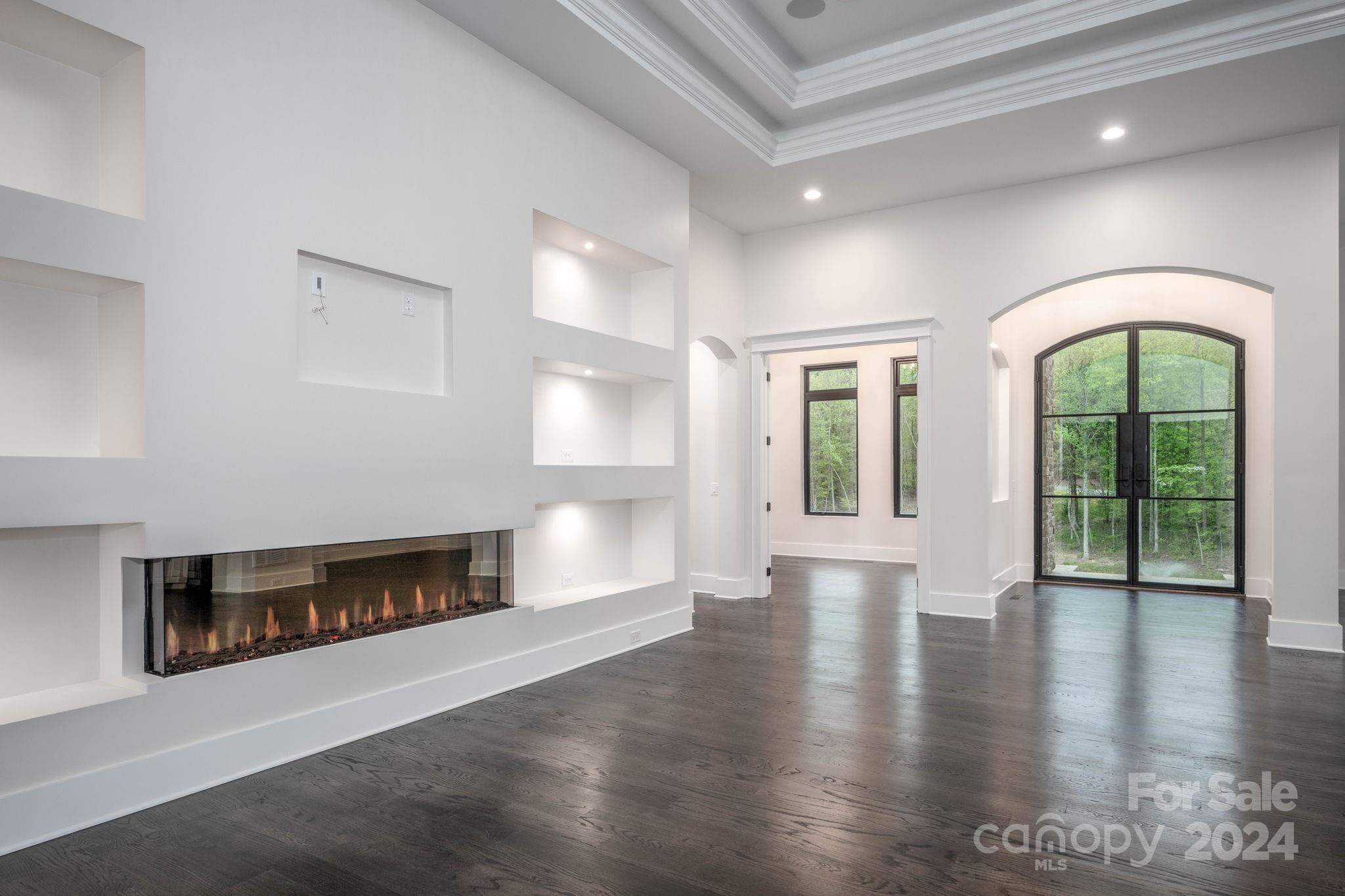 10290 Enclave Circle Concord, NC 28027 - Photo 20 of 48 a view of an empty room with window and fire place