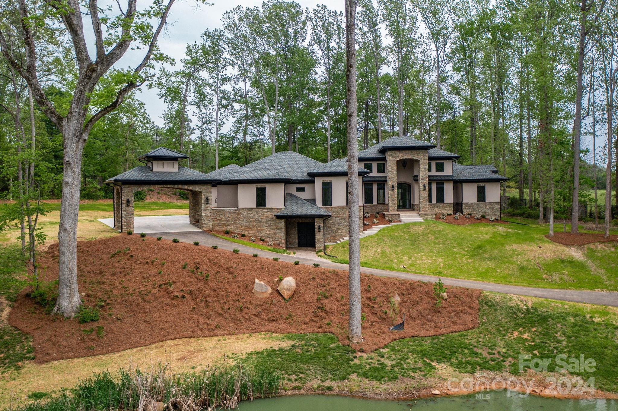 10290 Enclave Circle Concord, NC 28027 - Photo 2 of 48 front view of a house with a yard