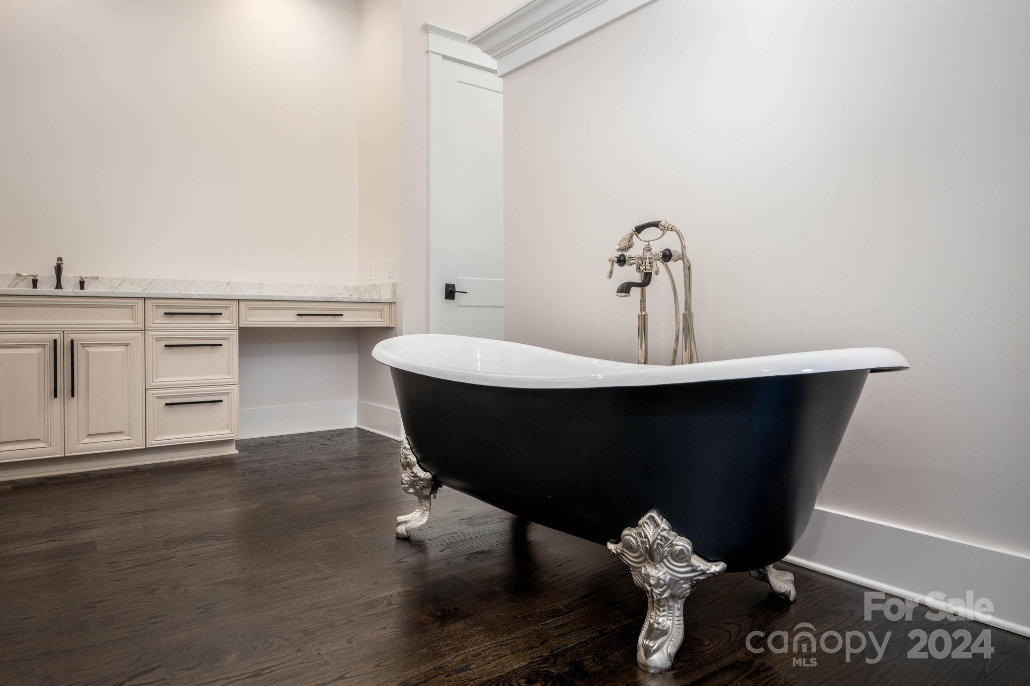 10290 Enclave Circle Concord, NC 28027 - Photo 31 of 48 a room with a table chairs and wooden floor