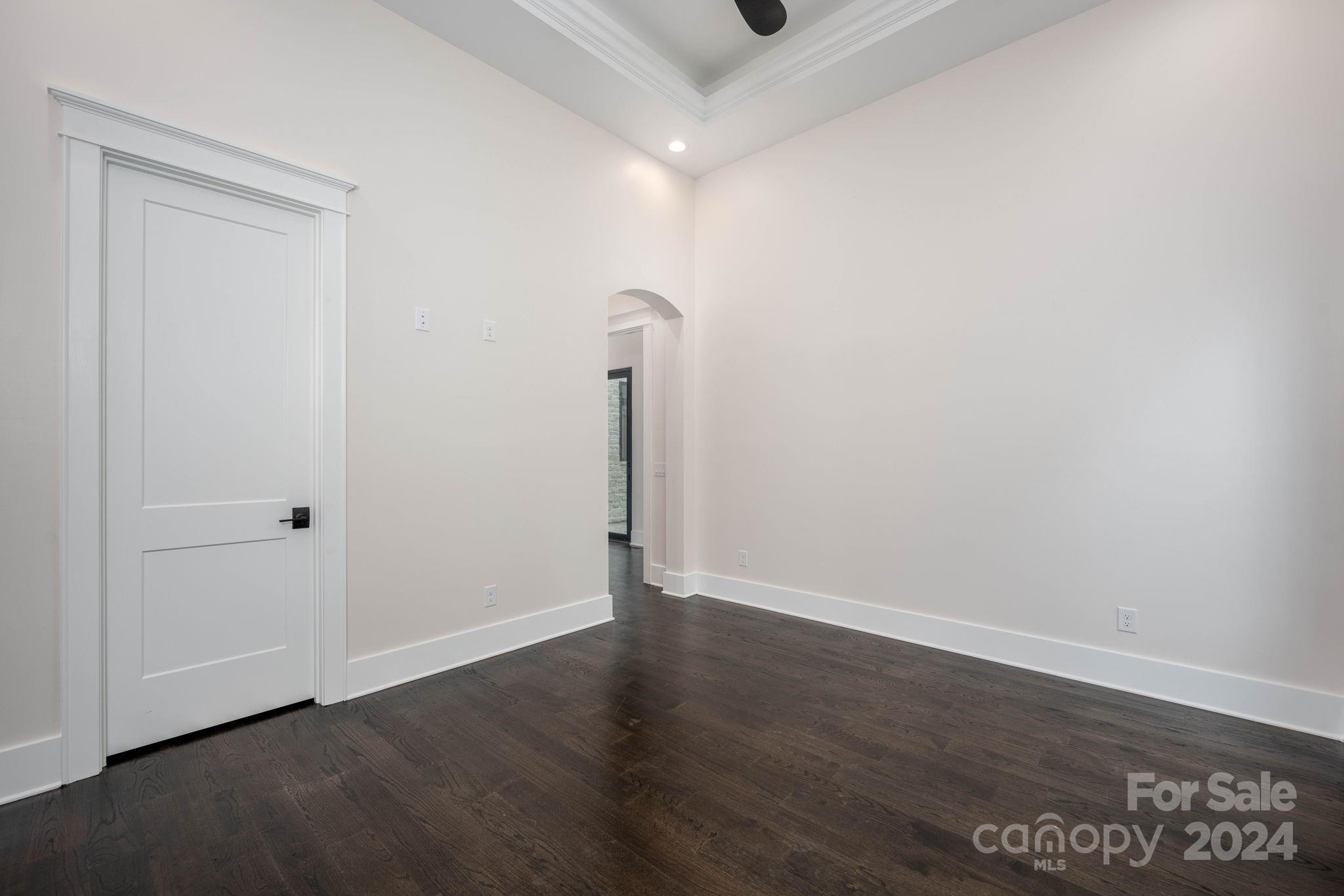 10290 Enclave Circle Concord, NC 28027 - Photo 32 of 48 a view of an empty room with wooden floor