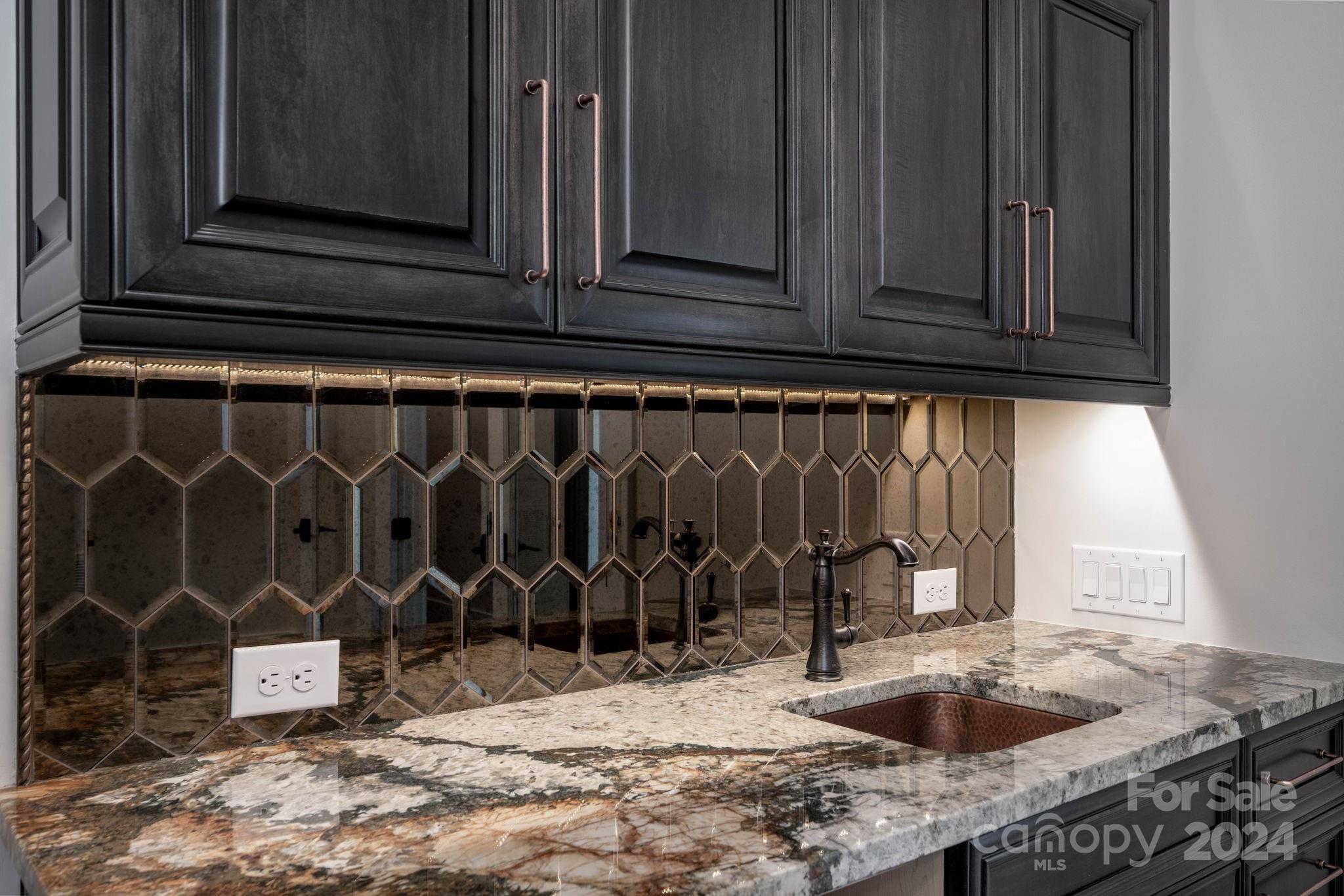 10290 Enclave Circle Concord, NC 28027 - Photo 40 of 48 a kitchen with granite countertop a sink and a stove
