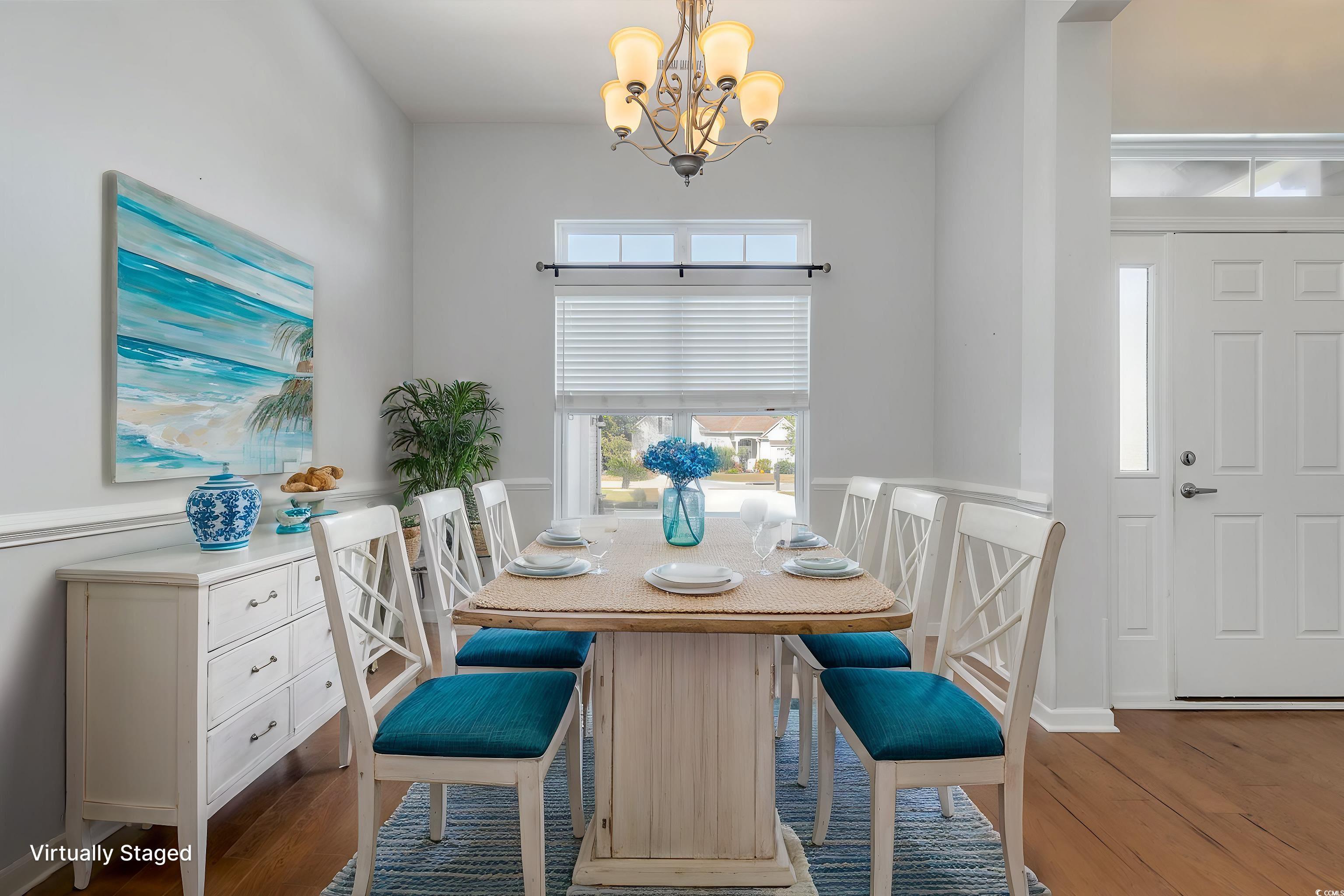 323 Trestle Way Conway, SC 29526 - Photo 7 of 40 Dining area with a chandelier and wood finished fl