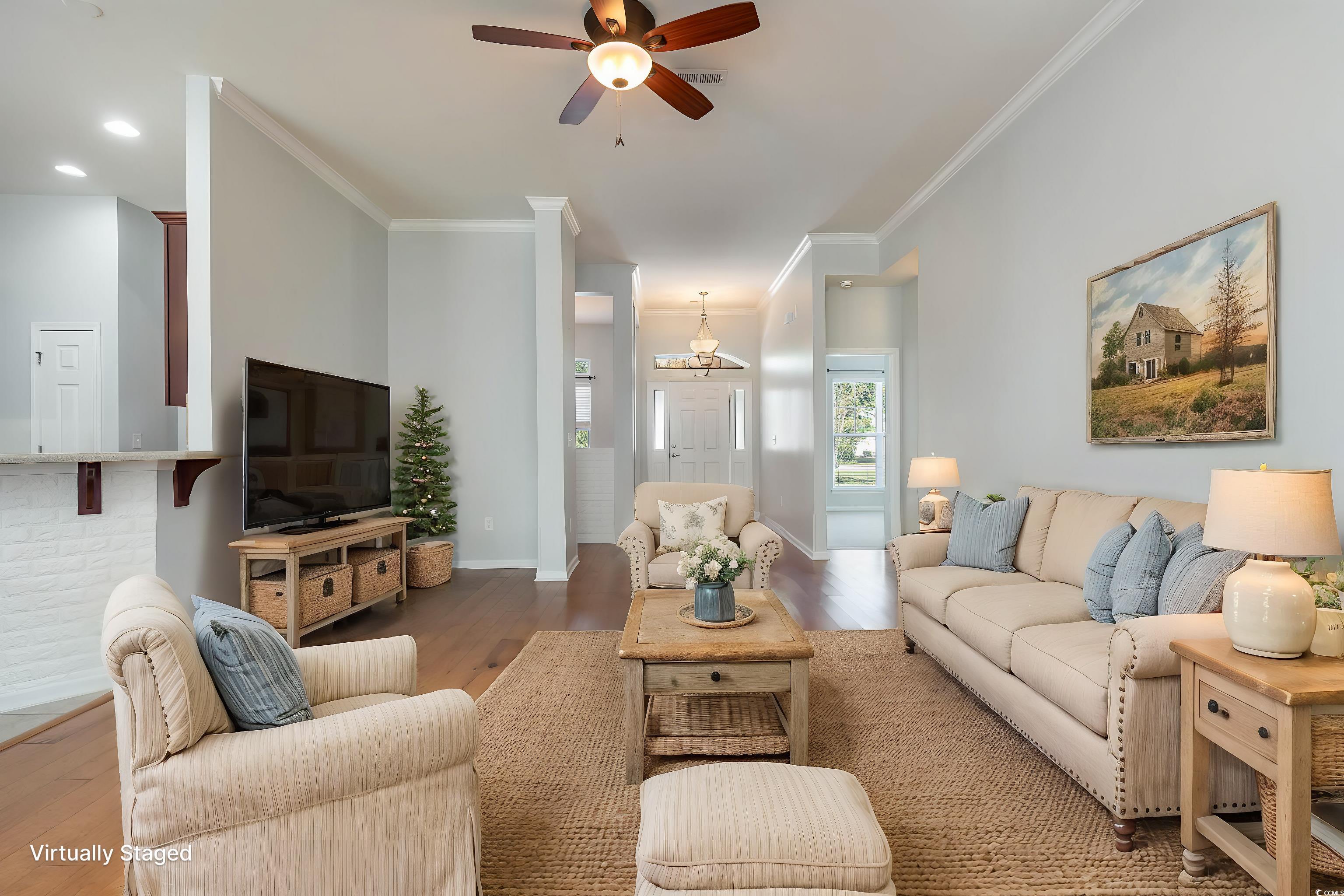 323 Trestle Way Conway, SC 29526 - Photo 9 of 40 Living area featuring wood finished floors, crown