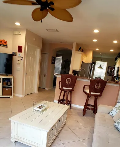 a kitchen with stainless steel appliances a stove a sink a microwave a refrigerator and cabinets