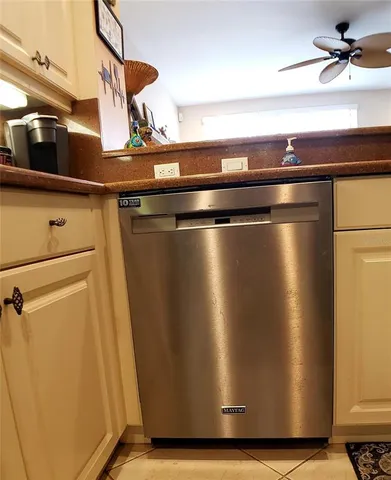 a bathroom with a granite countertop sink a toilet and bathtub