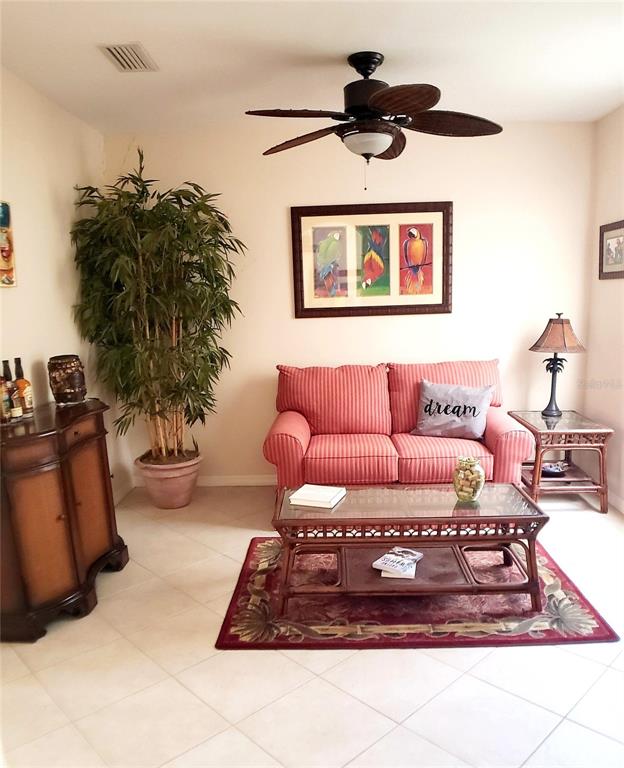 5662 Whitehead Street Bradenton, FL 34203 - Photo 27 of 51 a living room with furniture and a potted plant