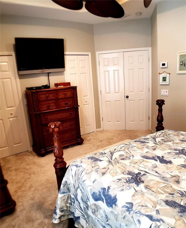 5662 Whitehead Street Bradenton, FL 34203 - Photo 32 of 51 a bedroom with a bed and a flat screen tv