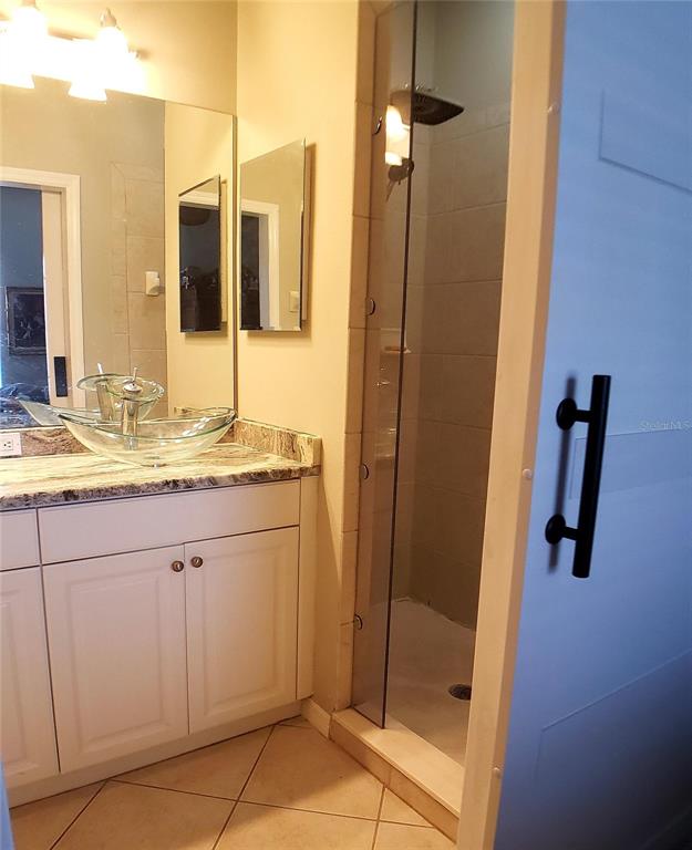 5662 Whitehead Street Bradenton, FL 34203 - Photo 33 of 51 a bathroom with a granite countertop sink and a mirror