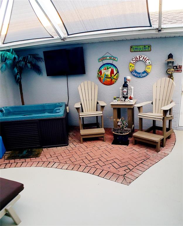 5662 Whitehead Street Bradenton, FL 34203 - Photo 46 of 51 a living room with furniture and a flat screen tv