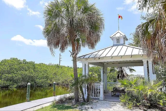 a living room with furniture and a kitchen view