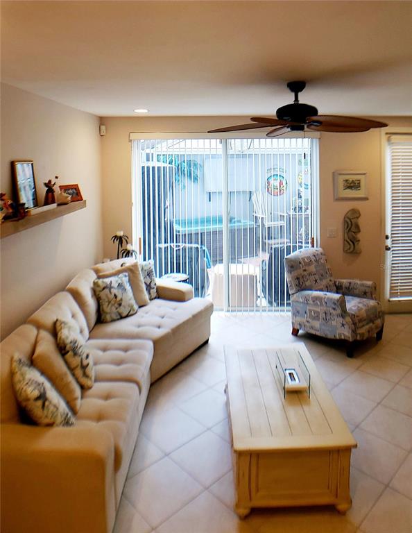 5662 Whitehead Street Bradenton, FL 34203 - Photo 10 of 51 a living room with furniture and a large window