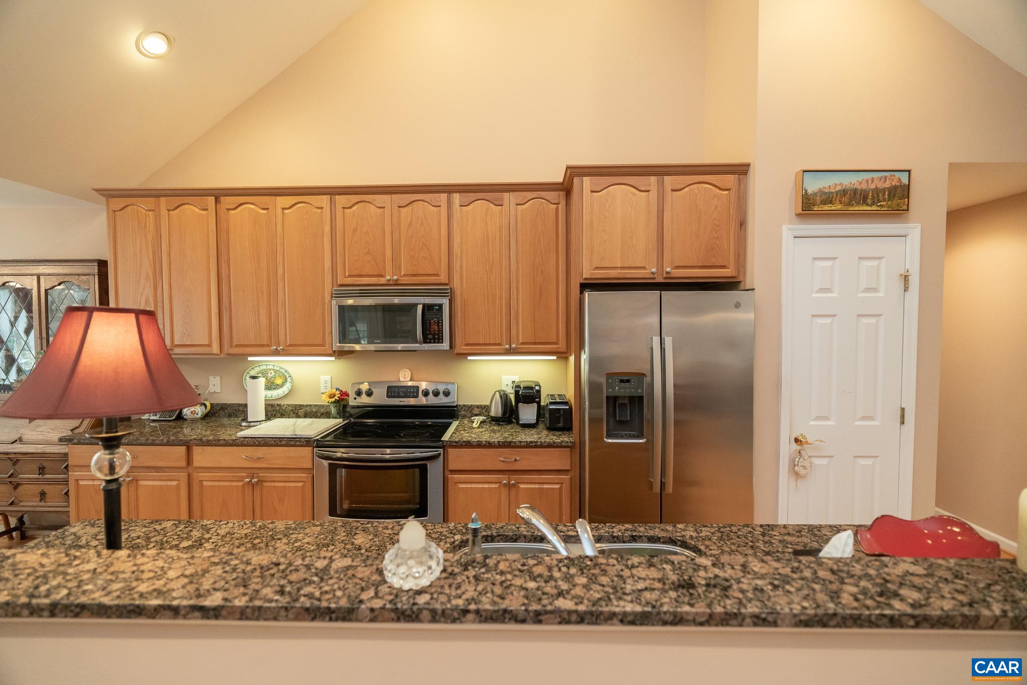9 Hawks Place Palmyra, VA 22963 - Photo 11 of 63 a kitchen with stainless steel appliances granite countertop a refrigerator and a stove
