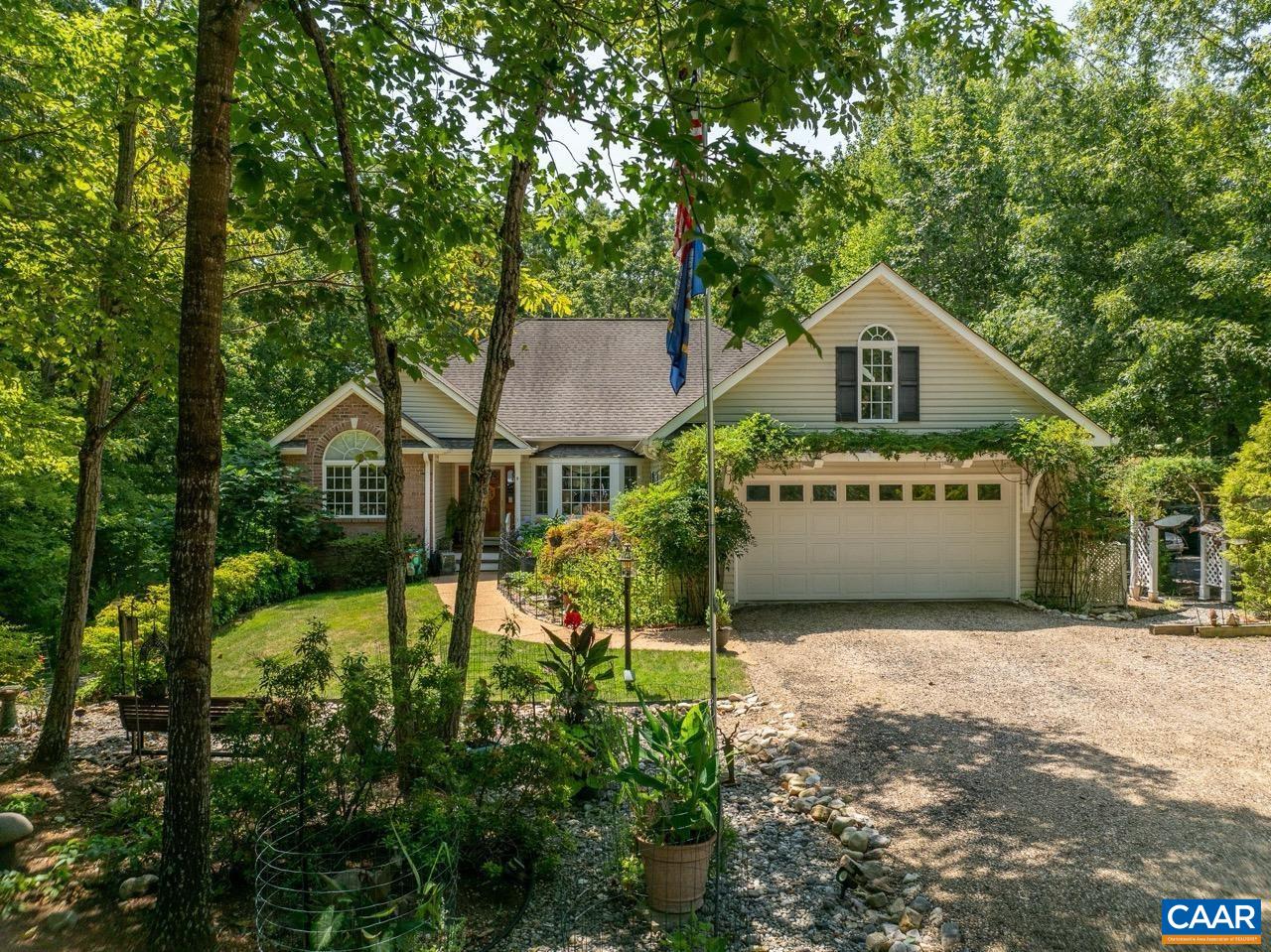 9 Hawks Place Palmyra, VA 22963 - Photo 2 of 63 a view of a house with a yard and large trees