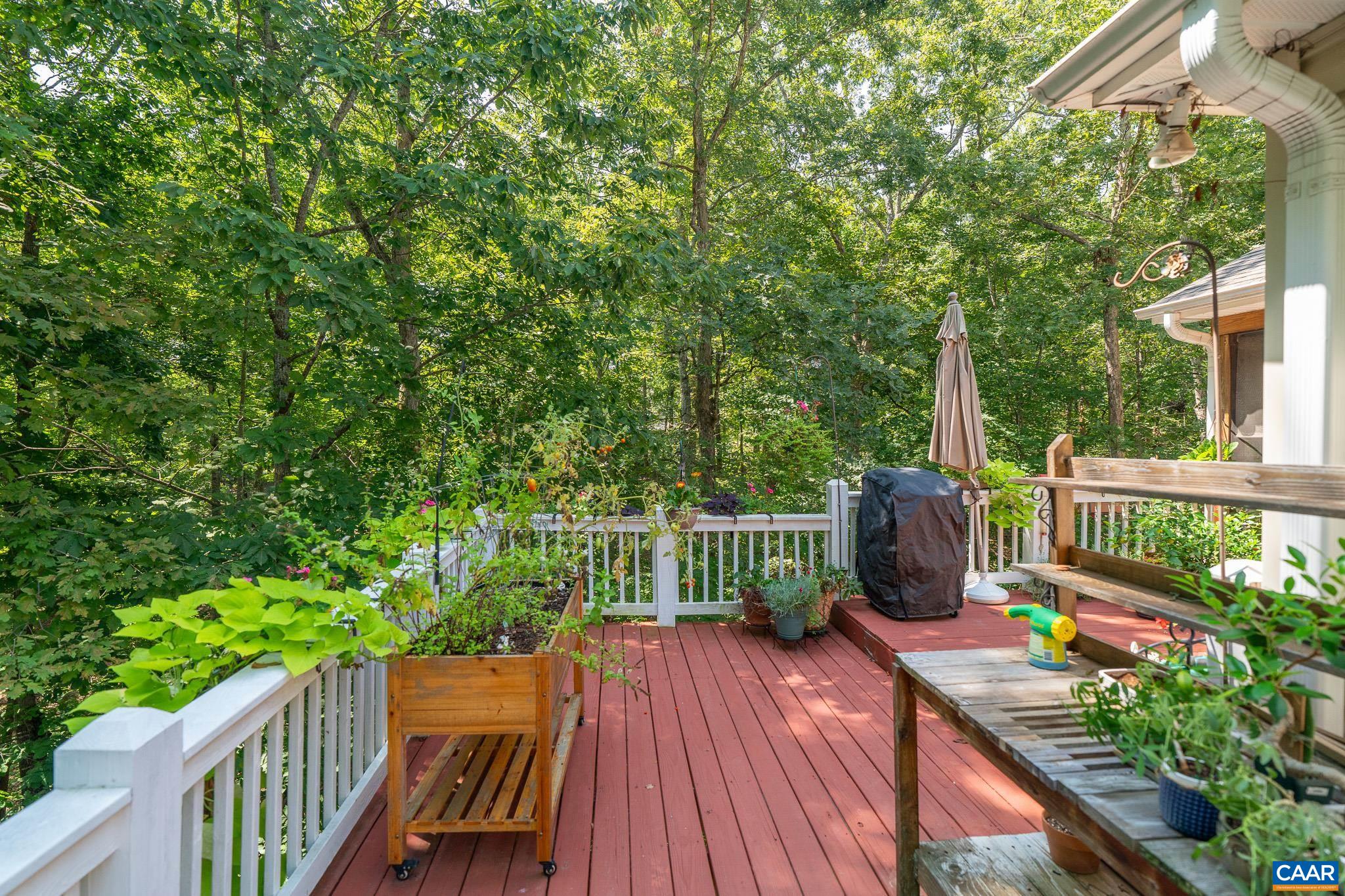 9 Hawks Place Palmyra, VA 22963 - Photo 23 of 63 a view of a balcony with wooden floor and outdoor seating