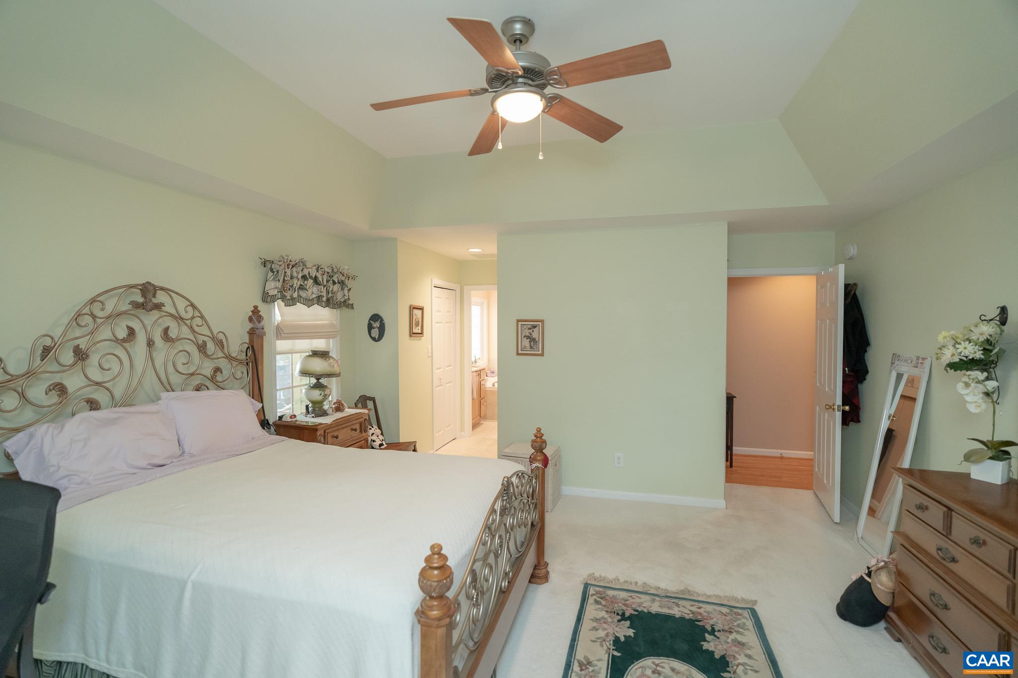 9 Hawks Place Palmyra, VA 22963 - Photo 28 of 63 a bedroom with a bed and a flat tv screen on the dresser