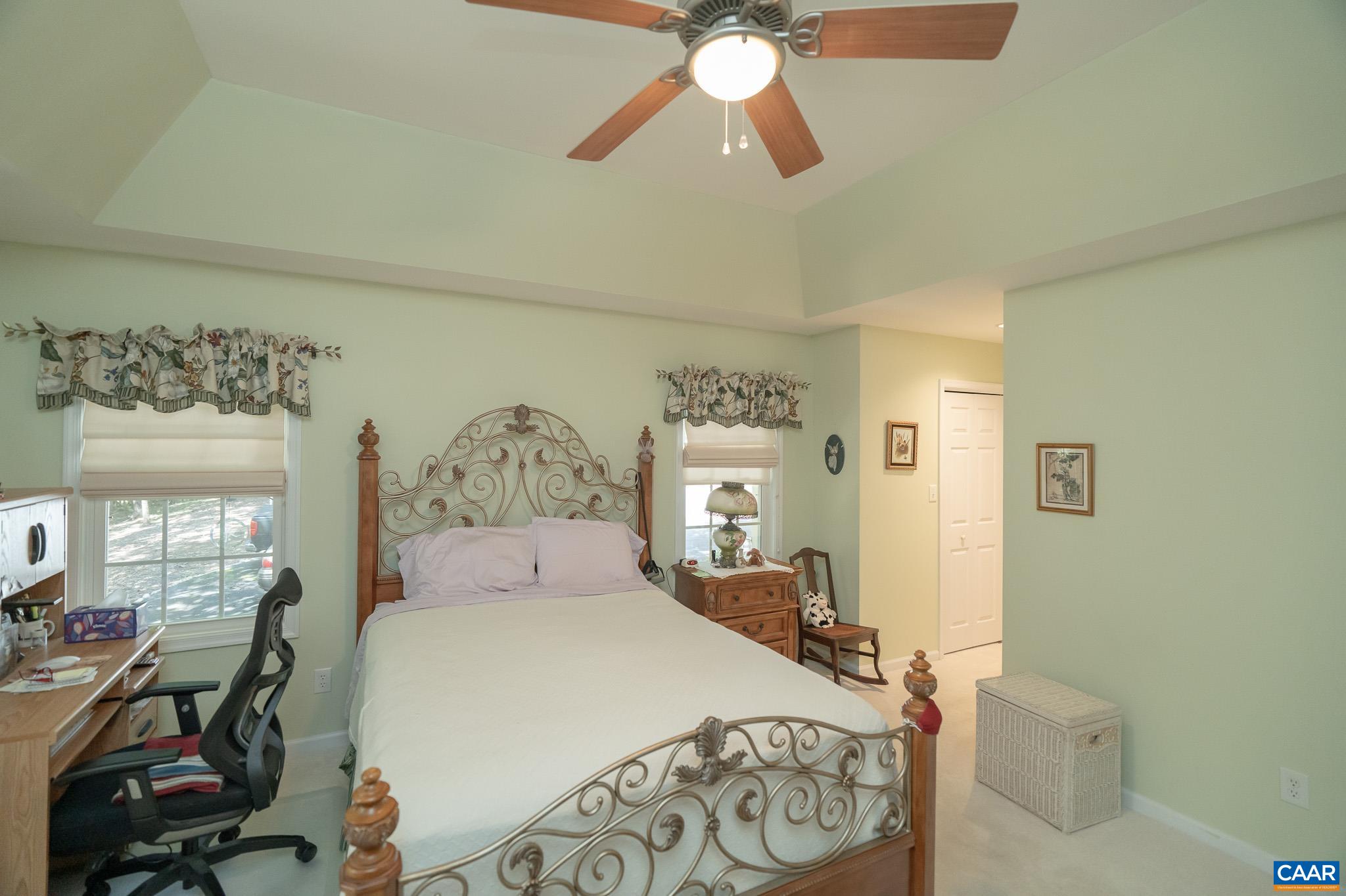 9 Hawks Place Palmyra, VA 22963 - Photo 29 of 63 a bedroom with a bed and a chandelier