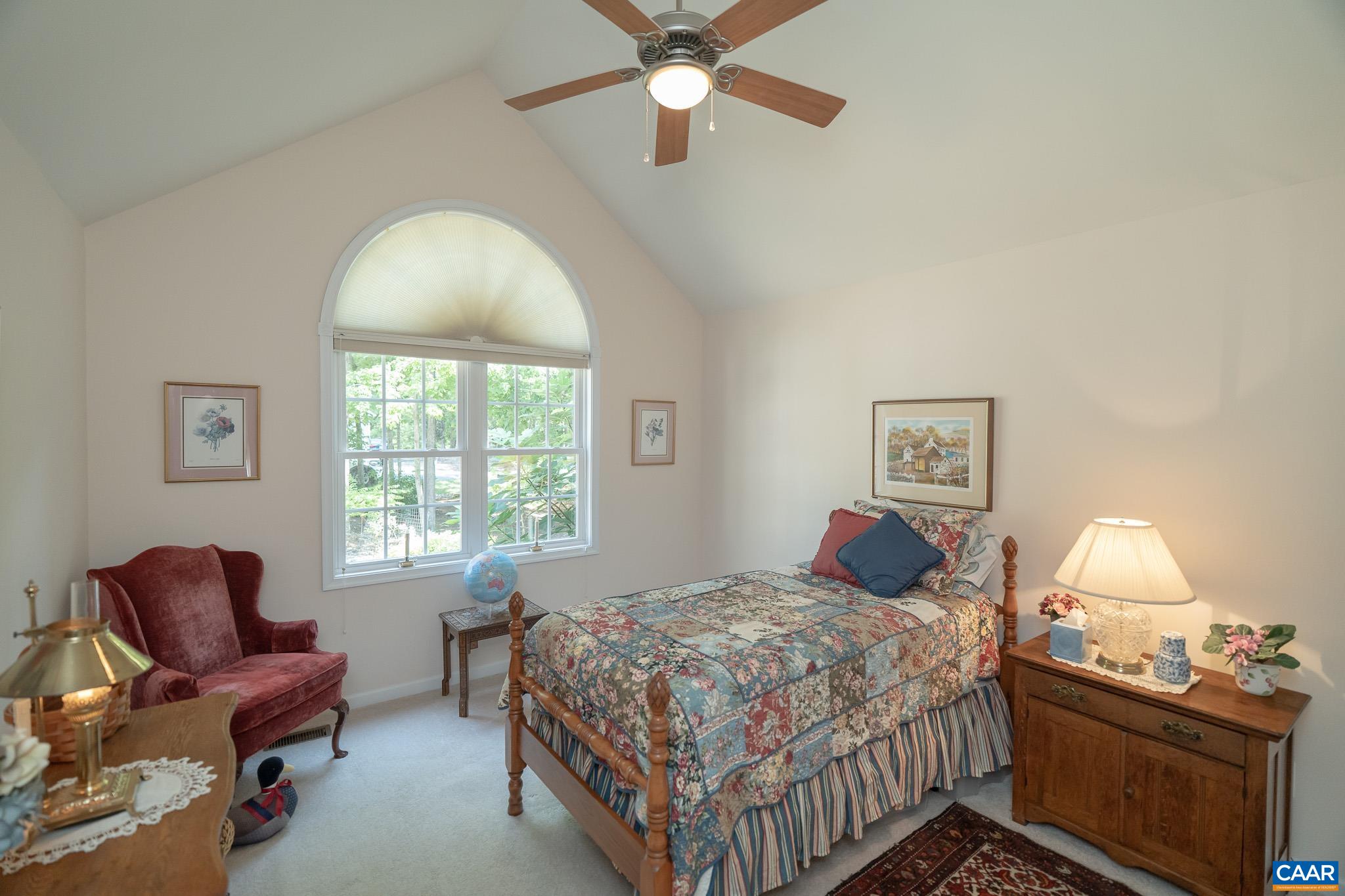 9 Hawks Place Palmyra, VA 22963 - Photo 34 of 63 a bedroom with a bed and a chandelier