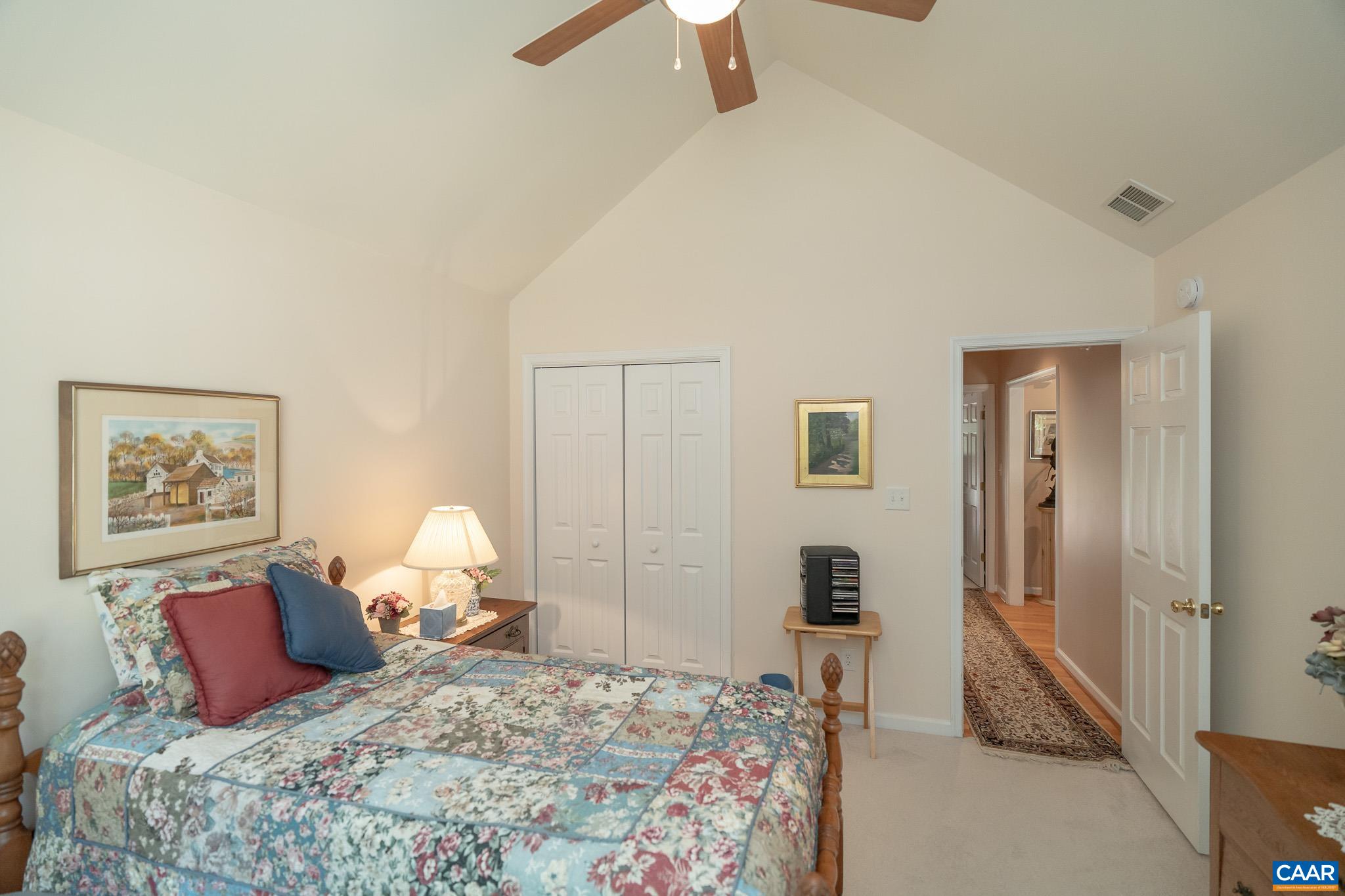 9 Hawks Place Palmyra, VA 22963 - Photo 35 of 63 a bedroom with a bed and a lamp