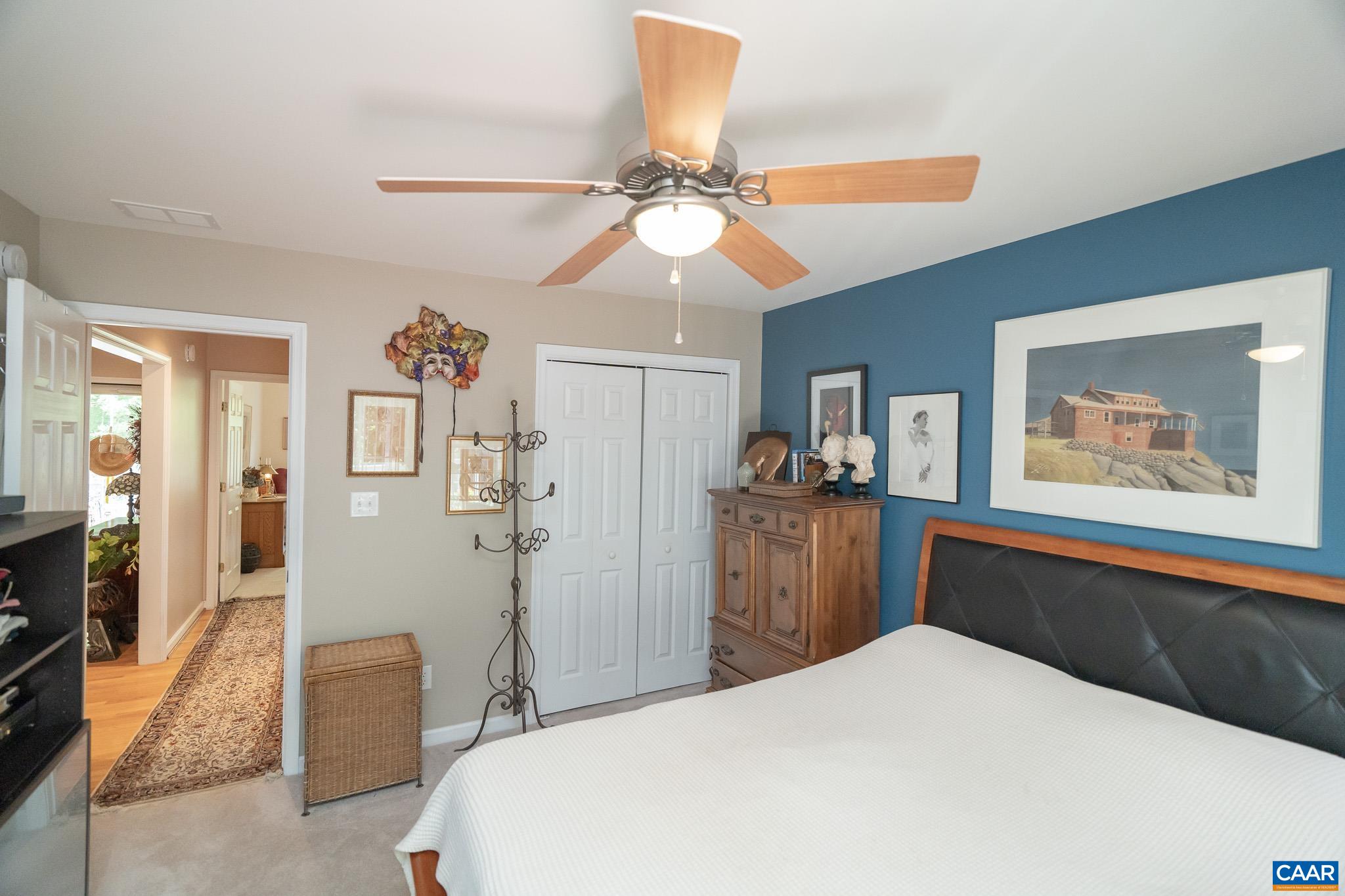 9 Hawks Place Palmyra, VA 22963 - Photo 39 of 63 a bedroom with a bed and a chandelier