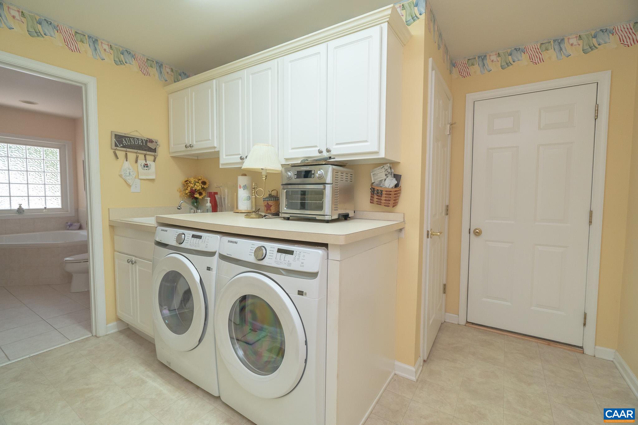 9 Hawks Place Palmyra, VA 22963 - Photo 40 of 63 a utility room with sink dryer and washer