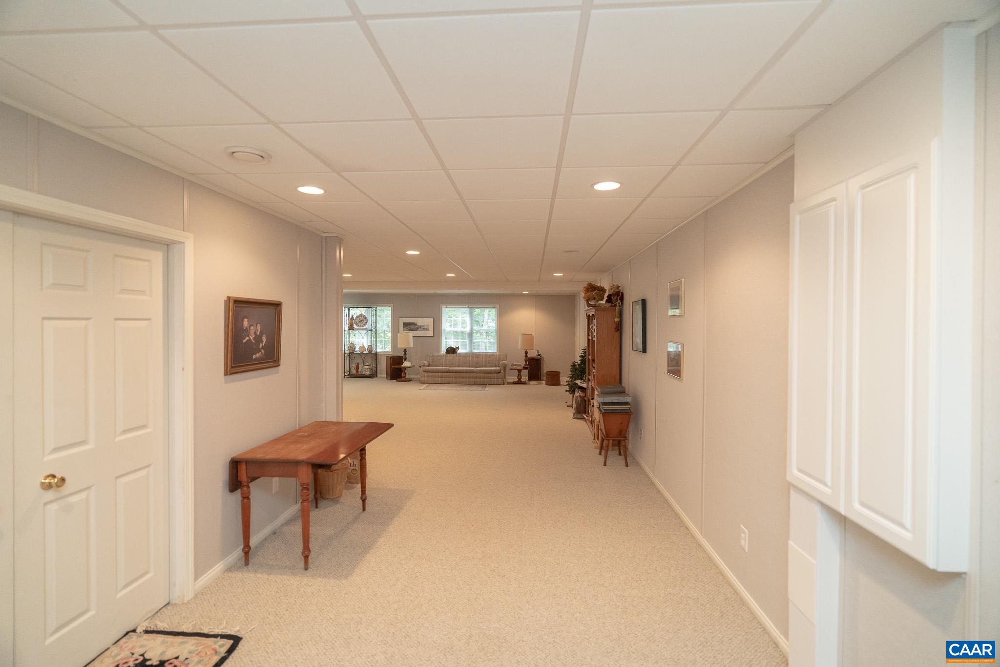 9 Hawks Place Palmyra, VA 22963 - Photo 45 of 63 a view of a hallway with wooden floor and furniture