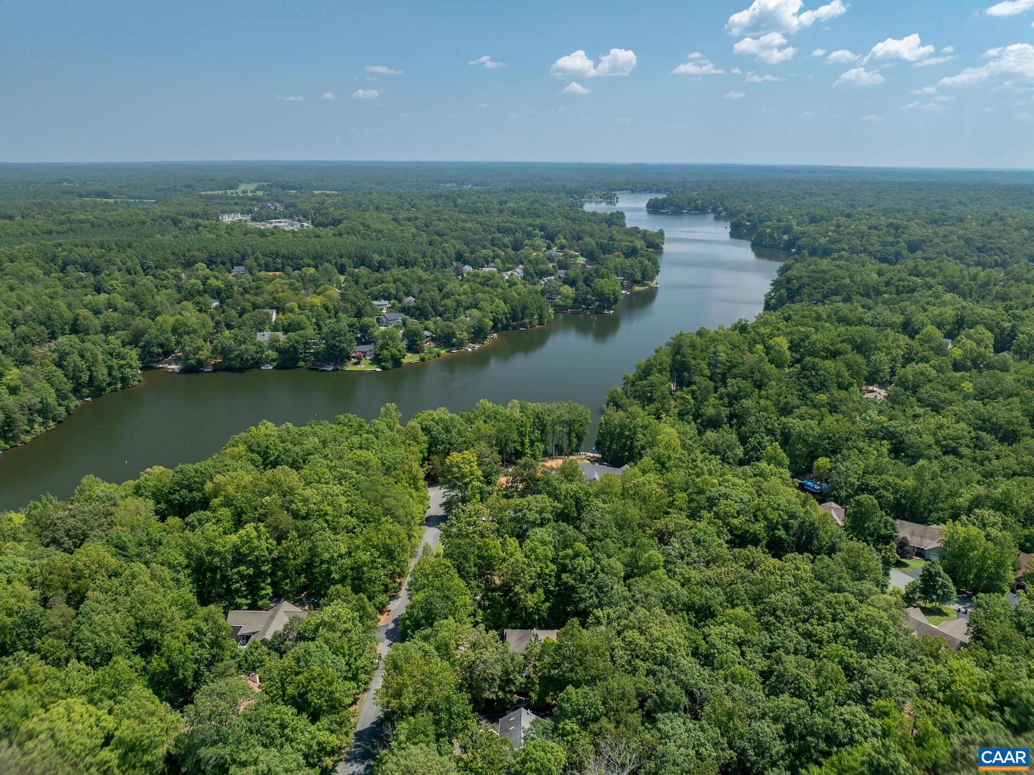 9 Hawks Place Palmyra, VA 22963 - Photo 60 of 63 an aerial view of a houses with a yard and lake view