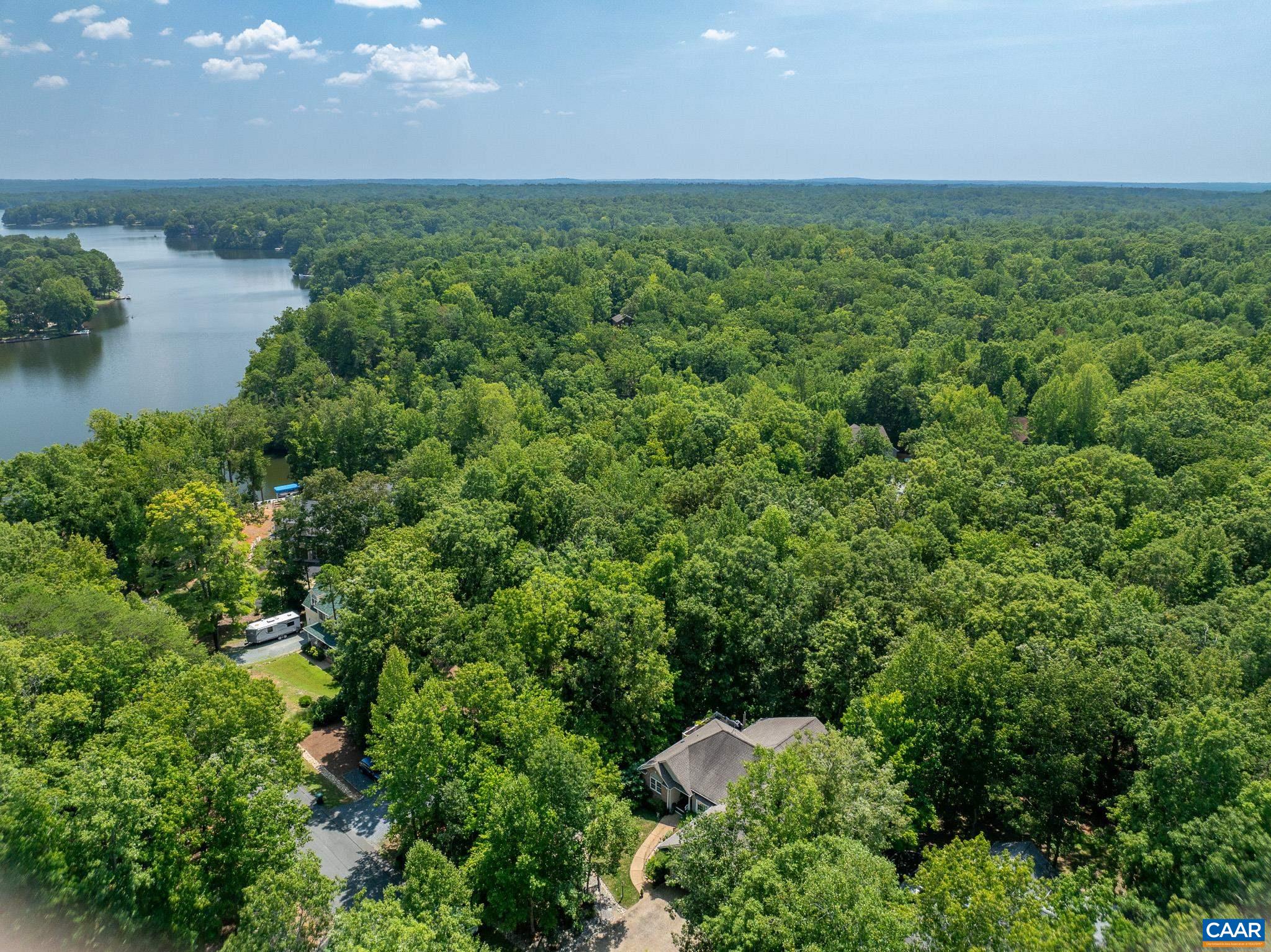 9 Hawks Place Palmyra, VA 22963 - Photo 62 of 63 an aerial view of a houses with a yard and lake view