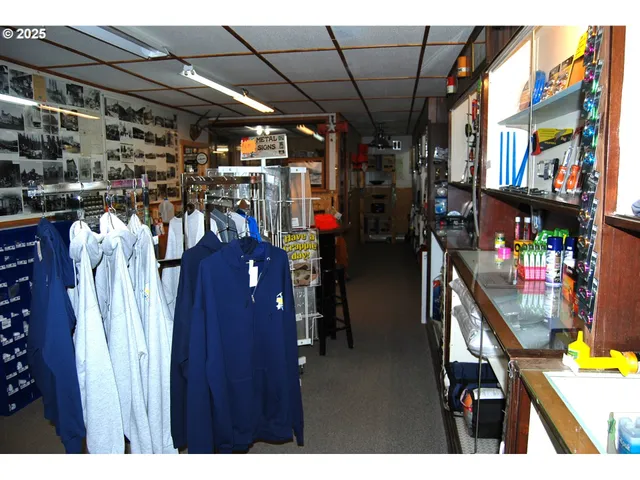a view of walk in closet with clothes