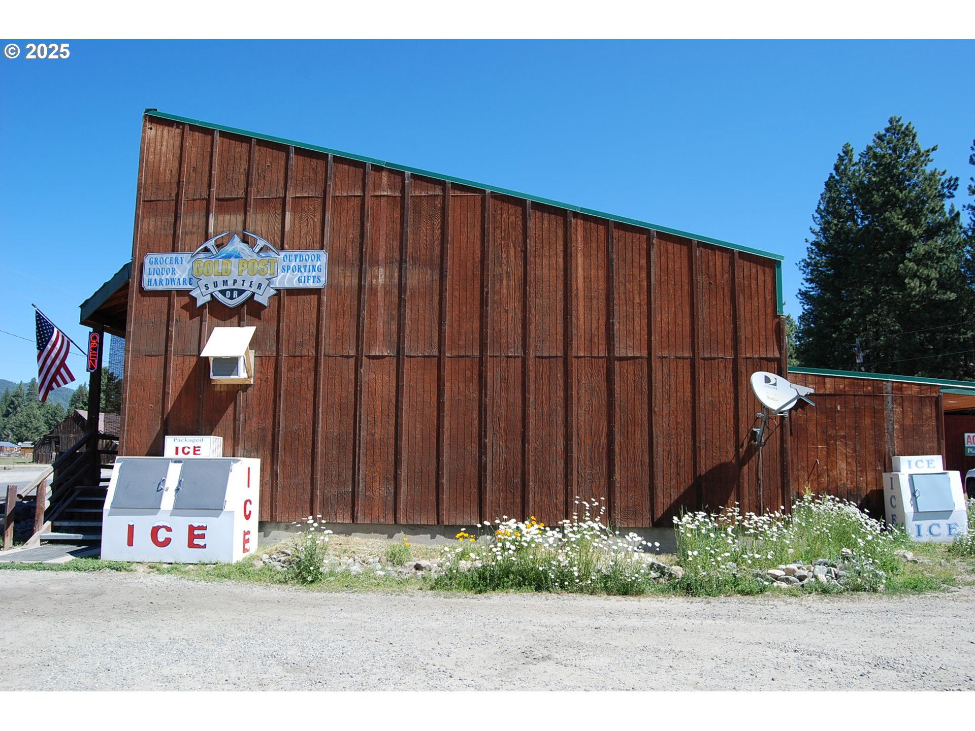 150 Mill Street Sumpter, OR 97877 - Photo 8 of 47 a view of a backyard with potted plants and wooden fence