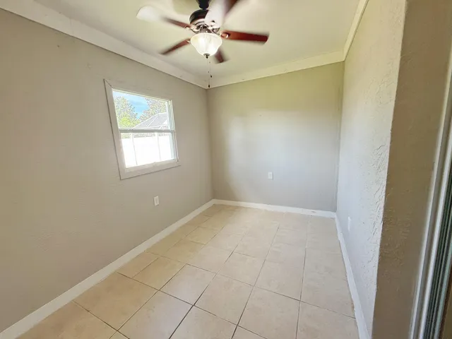 a view of an empty room with a window
