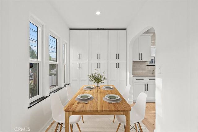 a view of kitchen with furniture and wooden floor