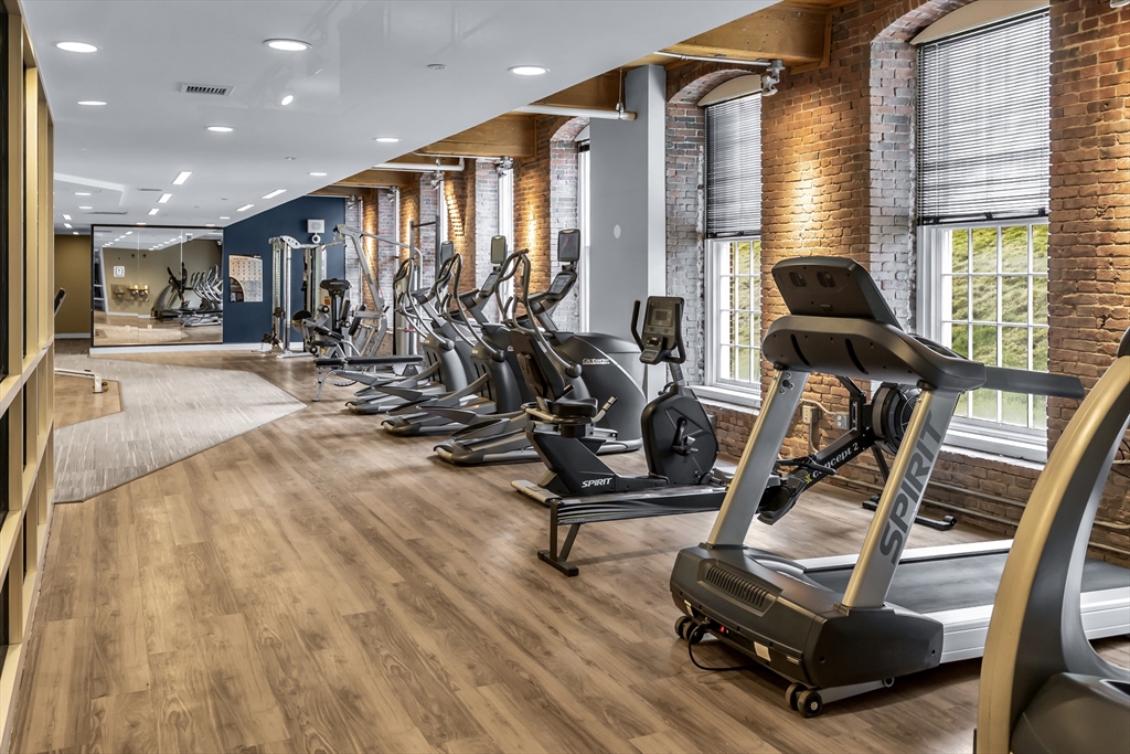130 John Street, Unit 216 Lowell, MA 01852 - Photo 15 of 17 a view of a room with gym equipment