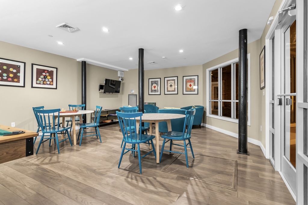 130 John Street, Unit 216 Lowell, MA 01852 - Photo 16 of 17 a view of a dining room with furniture