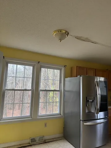 a view of a refrigerator in a room