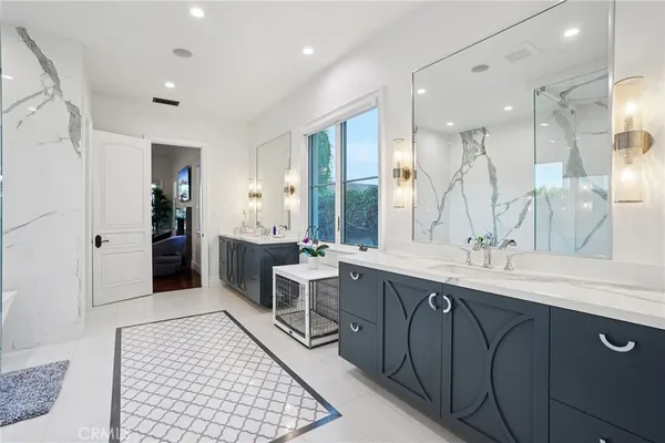 a bathroom with a granite countertop sink a toilet and shower