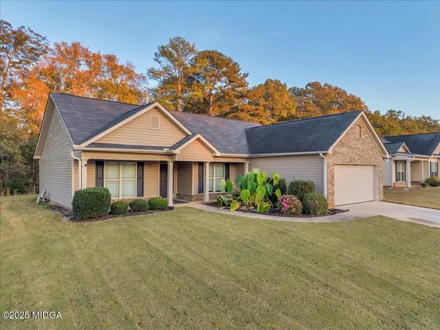 a front view of a house with a yard