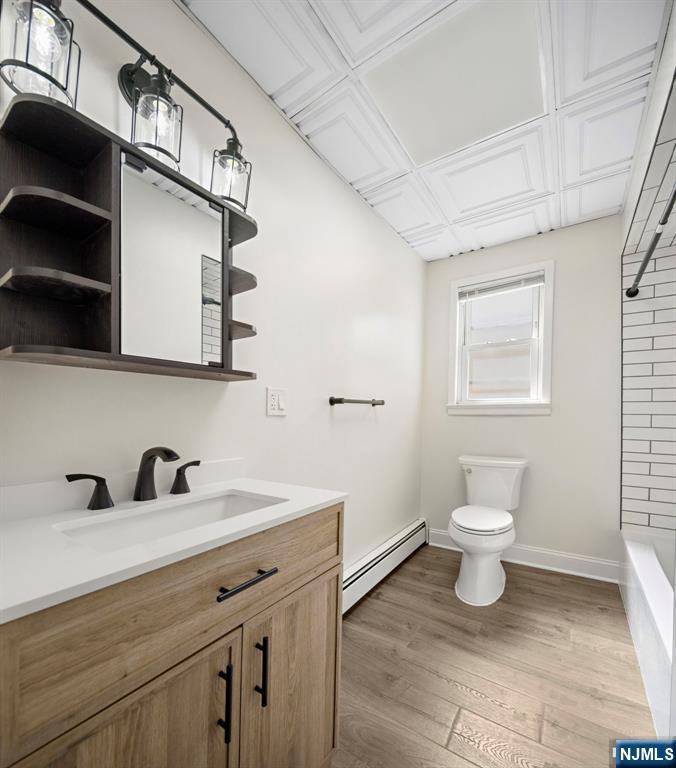 1534 Paterson Plank Road, Unit 2 Secaucus, NJ 07094 - Photo 15 of 17 a bathroom with a toilet sink and mirror