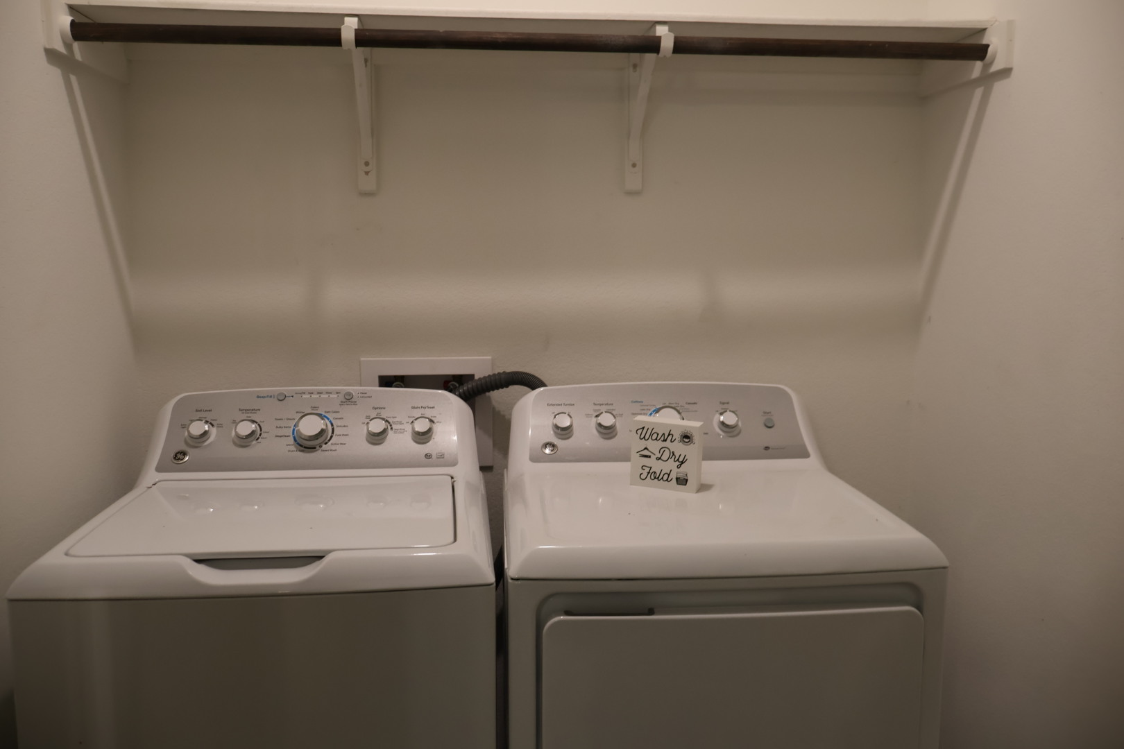 117 Galaxy Way Jarrell, TX 76537 - Photo 9 of 17 Dedicated laundry area featuring a built-in hanging rod and wall-mounted shelving support