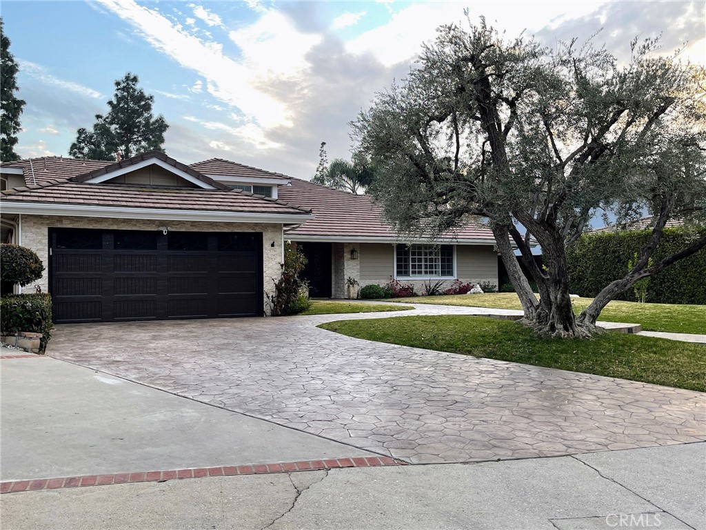 19520 Bermuda Street Porter Ranch, CA 91326 - Photo 2 of 2 a front view of a house with a yard and garage