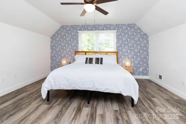 a bedroom with a bed and window