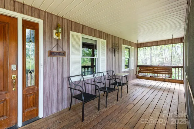 a view of a house with sitting area and wooden floor