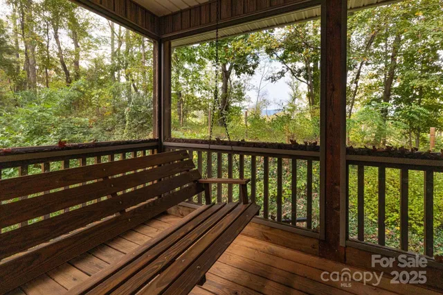 a view of two chairs in a balcony