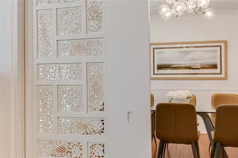 a painting on a wall next to a bathroom