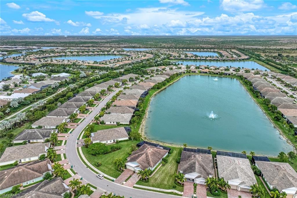 14822 Edgewater Circle Naples, FL 34114 - Photo 28 of 28 an aerial view of a residential houses with outdoor space and ocean view